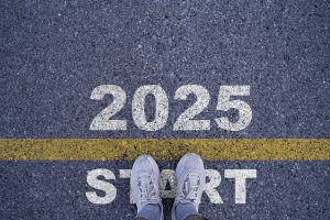 Runner standing at the starting point with 2025 year for starting in new year 2025 to achieve 