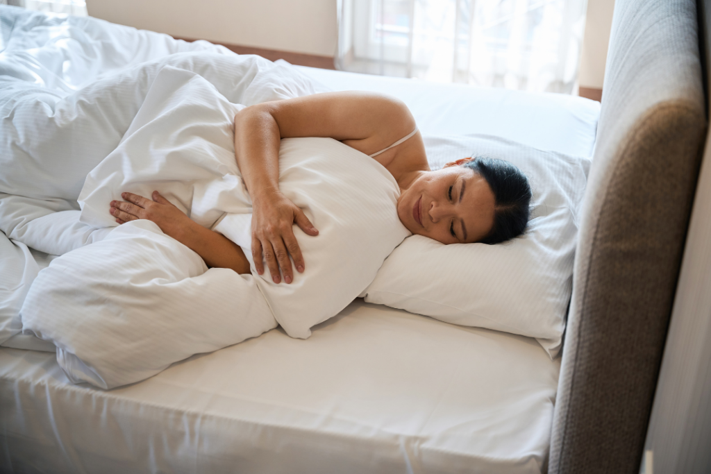woman demonstrating how to sleep after surgery